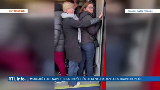 Des voyageurs de la SNCB font face à des trains bondés