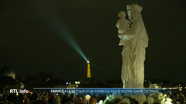 Cinq ans après avoir réchappé de l'incendie de la cathédrale Notre-Dame de Paris, la célèbre statue de la Vierge à l'Enfant retrouve sa maison accompagnée à la nuit tombée par des centaines de fidèles en procession, cierge à la main, dans le coeur de la capitale.