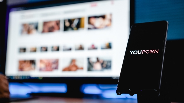 Granada, Spain; June 4, 2022: YouPorn Website on the Screen smartphone and computer screen on background. Illustrative editorial