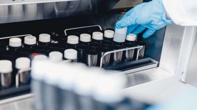 Medical professional places samples in sperm bank for storage and analysis. Concept cloning.