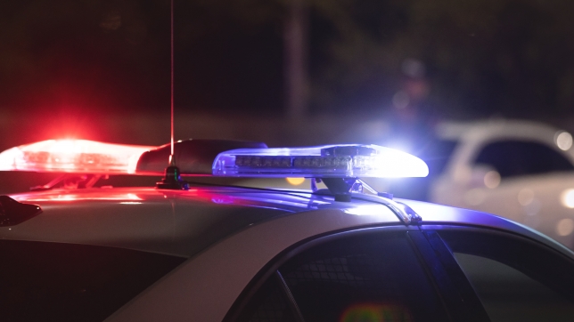 Red and blue light flasher. Police car at night time in the city