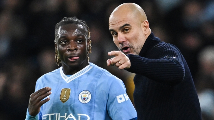 Jérémy Doku et Pep Guardiola.