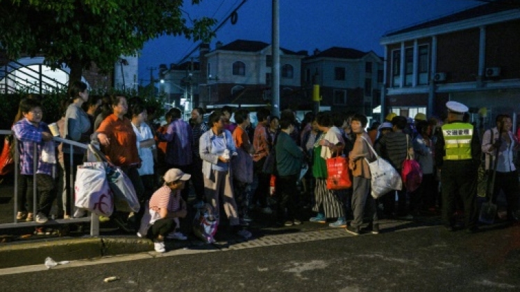 A l'aube à Shanghai, la recherche d'un emploi pour la journée