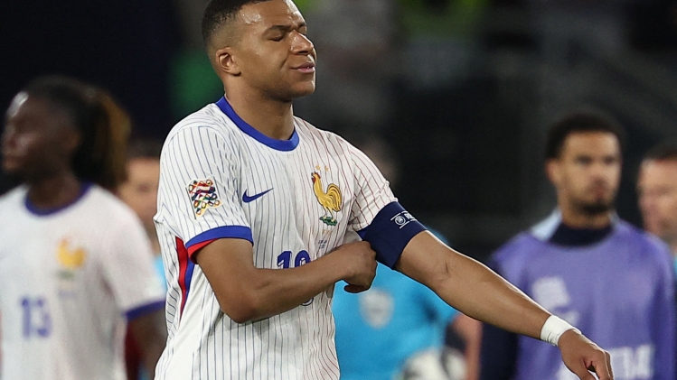 France's forward #10 Kylian Mbappe (C) and his teammates react after the UEFA Nations League semi-final football match between Spain and France in Stuttgart, southwestern Germany, on June 5, 2025. (Photo by FRANCK FIFE / AFP) / ALTERNATIVE CROP