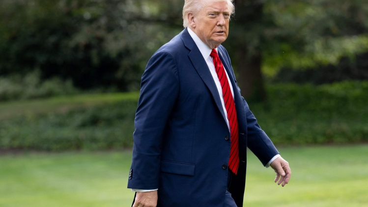 US President Donald Trump walks on the South Lawn of the White House upon returning from Walter Reed National Military Medical Center after a medical checkup on October 10, 2025, in Washington, DC. (Photo by SAUL LOEB / AFP)