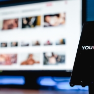 Granada, Spain; June 4, 2022: YouPorn Website on the Screen smartphone and computer screen on background. Illustrative editorial