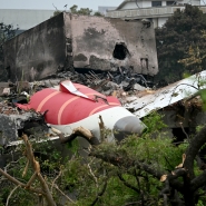 Debris of Air India flight 171 is pictured after it crashed in a residential area near the airport in Ahmedabad on June 13, 2025. Rescue teams with sniffer dogs combed the crash site on June 13 of a London-bound passenger jet which ploughed into a residential area of India's Ahmedabad city, killing at least 265 people on board and on the ground. (Photo by Punit PARANJPE / AFP)