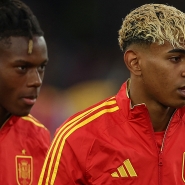 Spain's forward #19 Lamine Yamal (R) and Spain's forward #11 Nico Williams (L) walk on to the pitch prior to the UEFA Nations League semi-final football match between Spain and France in Stuttgart, southwestern Germany, on June 5, 2025. (Photo by FRANCK FIFE / AFP)