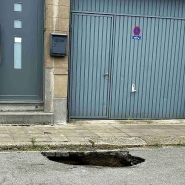 A hole was formed on rue de la Glacerie. Nevertheless, in Courcelles, on June 26, 2025, in front of Céline's house. cracks facades, 1m50 hole roads: