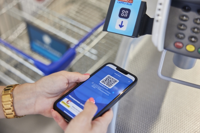 Un détecteur installé à chaque caisse pour scanner sa carte de fidélité.